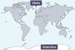 Map of the world with Antarctica and Wales labelled on it.