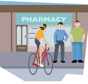 Cyclist outside pharmacy.