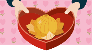 Two hands holding a heart shaped open chocolate box containing an onion