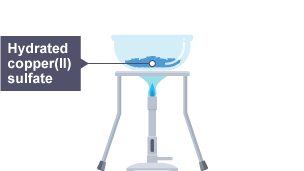 Bunsen burner heating a bowl of hydrated copper(II) sulfate. 