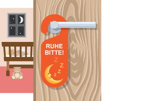 A do not disturb sign on the handle of a door which is ajar, with a sleeping baby in the background.