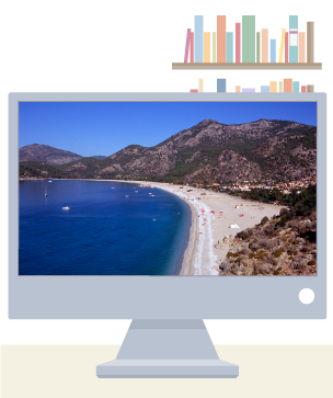 A desktop screen showing a long beach with mountains in the background.