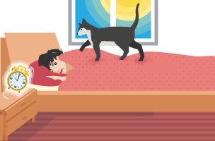 A woman lying in bed with her alarm clock ringing looking like she doesn't want to get up and a cat walking on the bed.