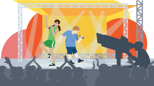 A girl and boy singing on stage with a crowd and TV cameras watching.