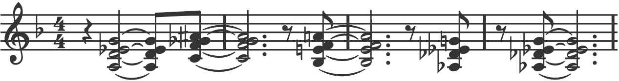 A line of musical notation in treble clef showing four bars of extended chords.